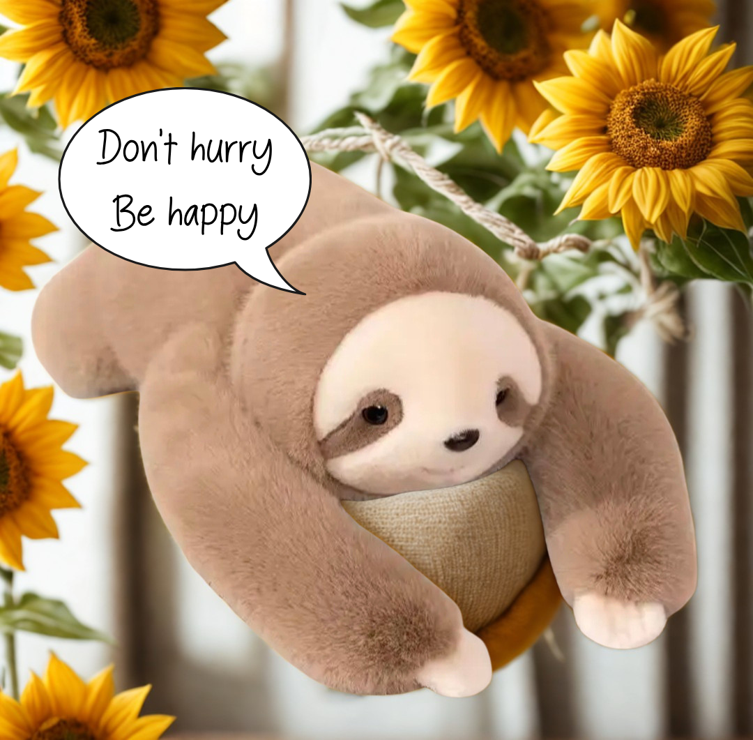 Weighted sloth plush hanging among sunflowers with a 'Don't hurry, be happy' speech bubble